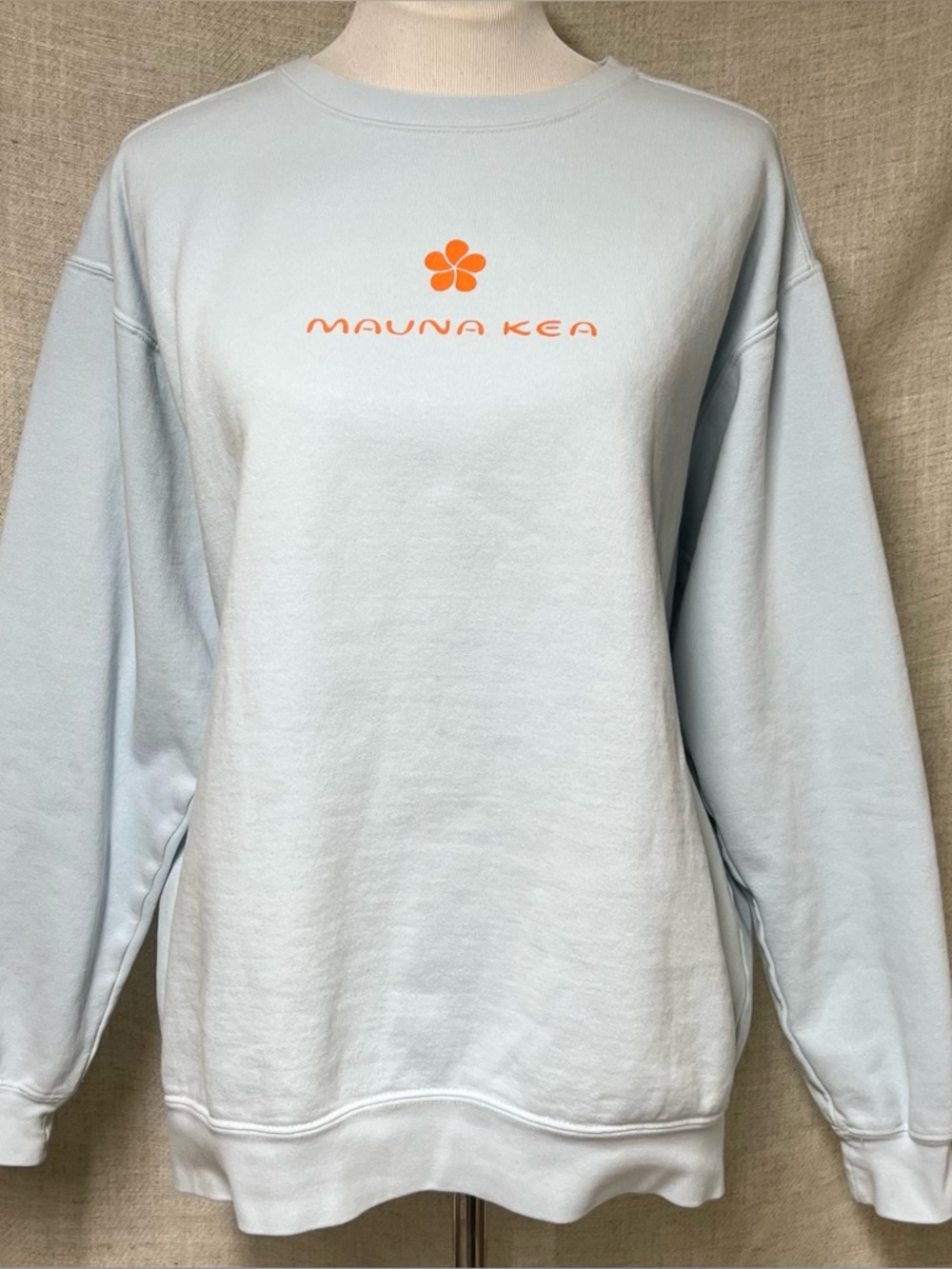 Mauna Kea Light Blue Sweatshirt with Orange Logo
